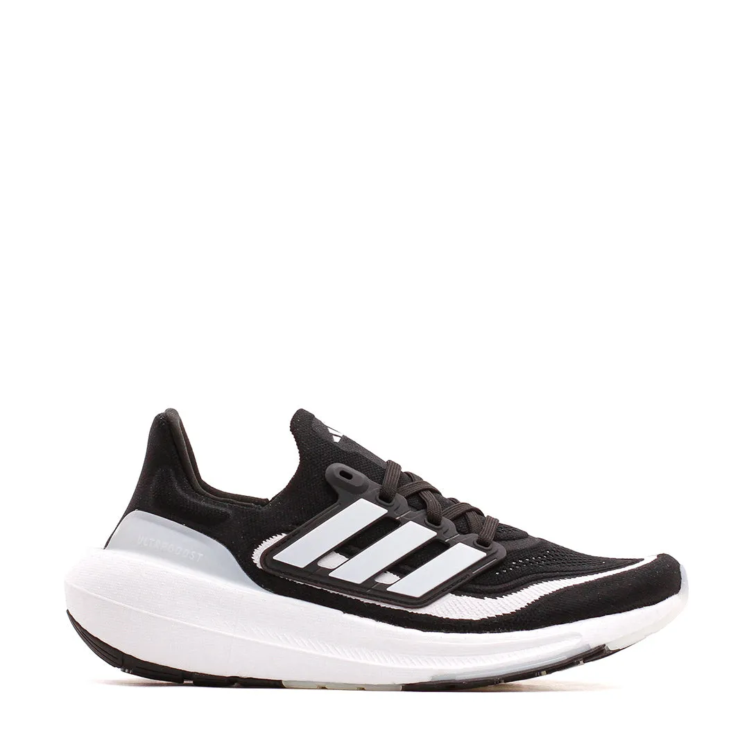 Adidas Running Women Ultraboost Light Black HQ6345 Running T Shirts running on a wooden track shoes