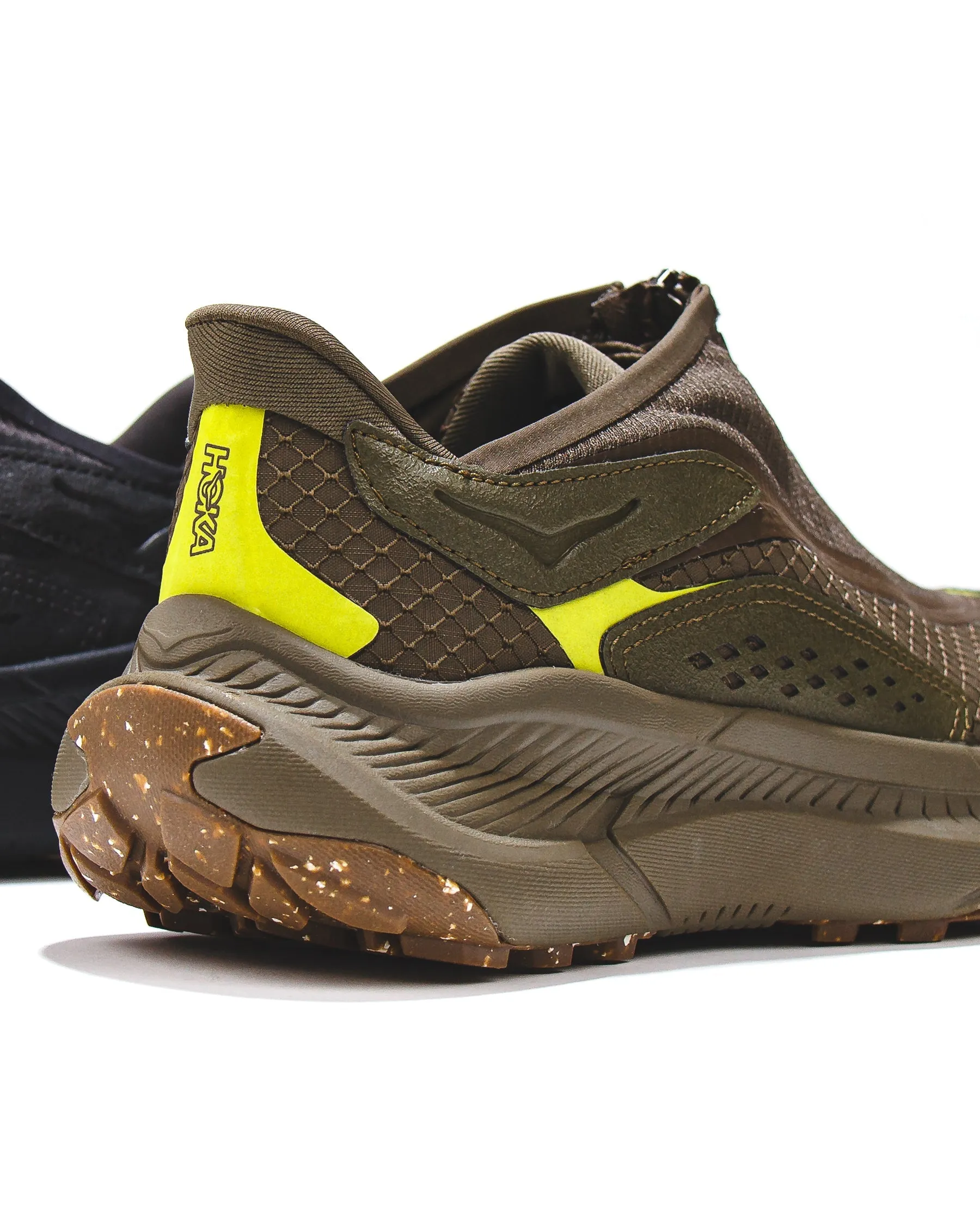 Hoka One One Men Project Transport Deep Umber 1162850-DTQ running on concrete