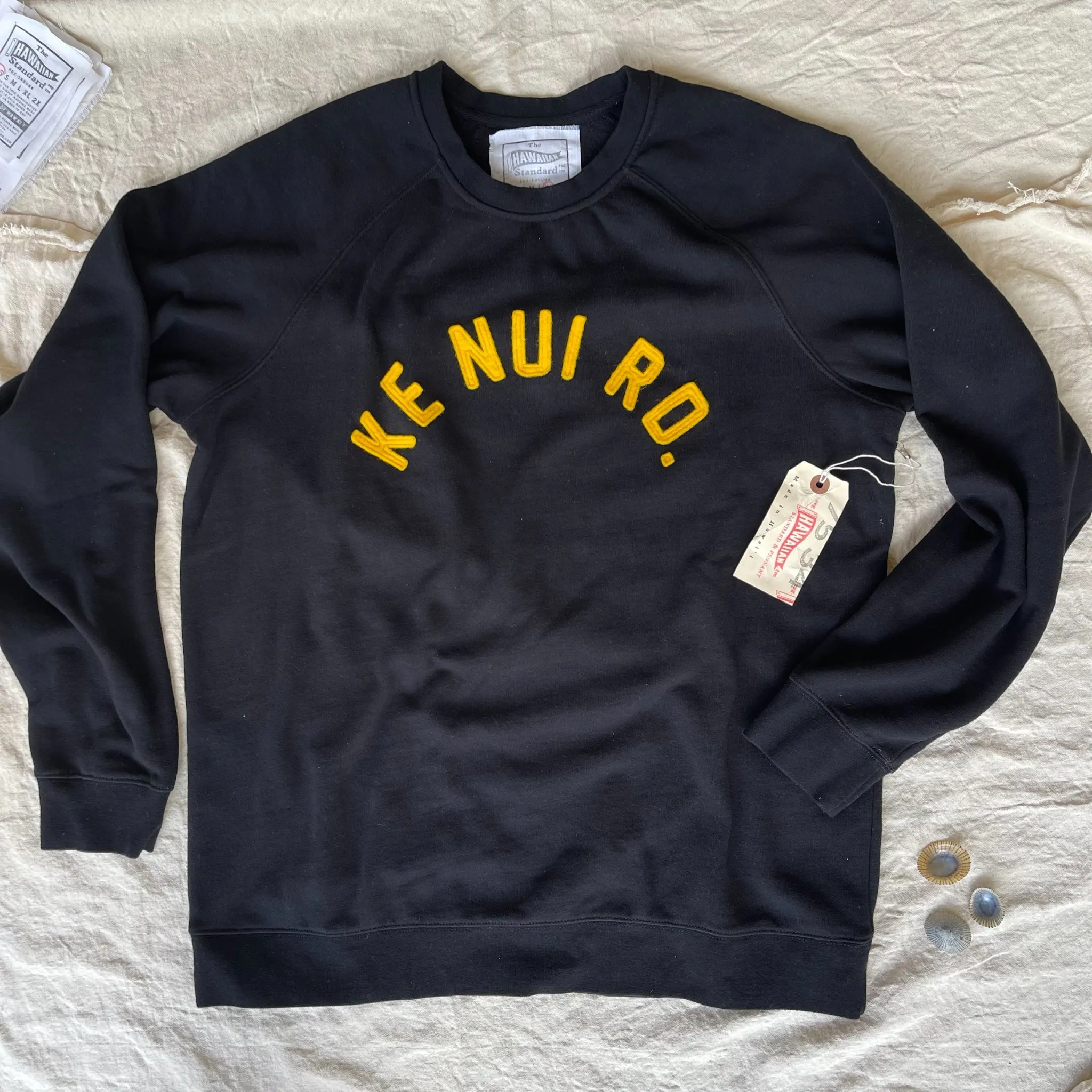 product festival wearability product sporty appeal Mens Raglan Fleece Black x KE NUI RD. Gold applique