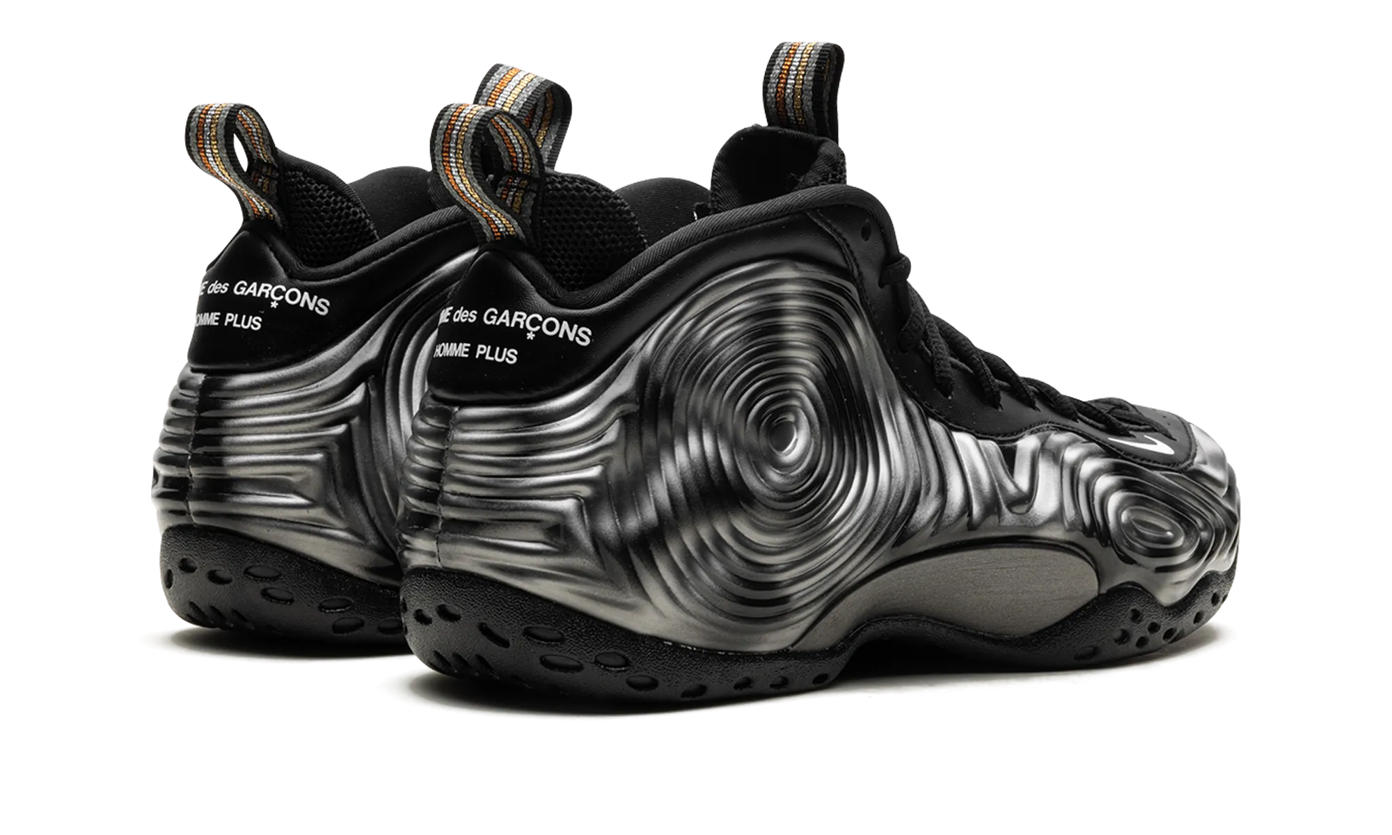 Air Foamposite One SP "CDG Homme Plus - Black White" running with a carbon fiber plate